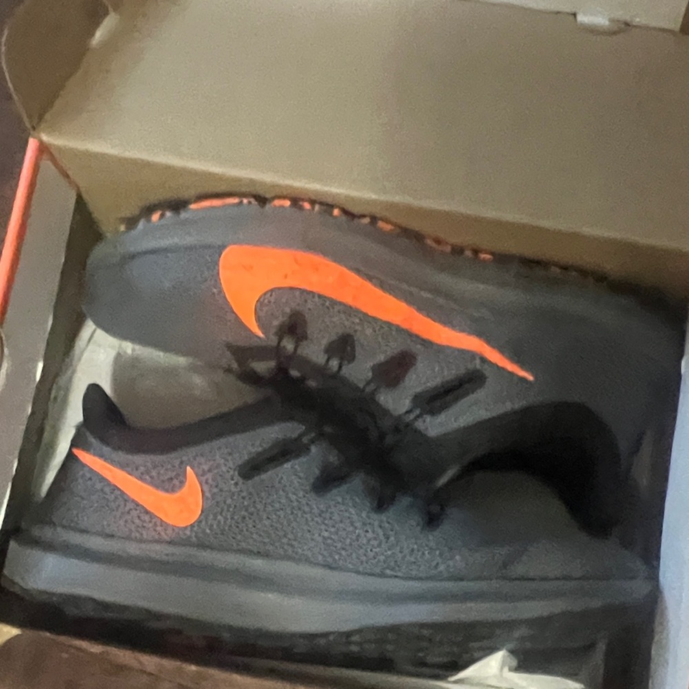 Nike Black Sneakers with Orange Swoosh Accents